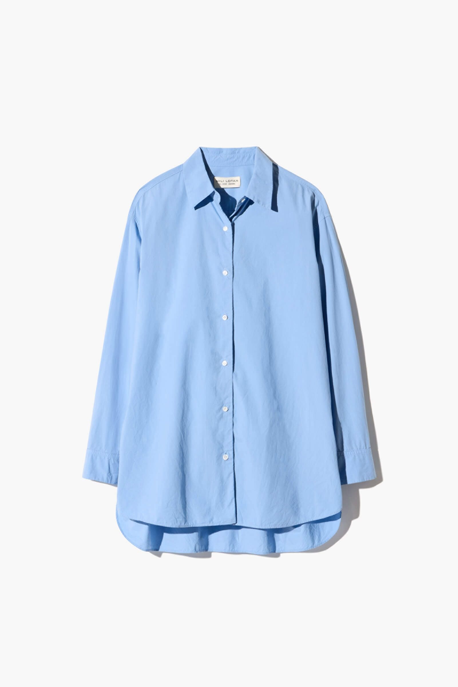 Light blue long-sleeve button-up shirt with a rounded hem.