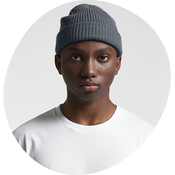Model wearing a slate grey ribbed knit beanie