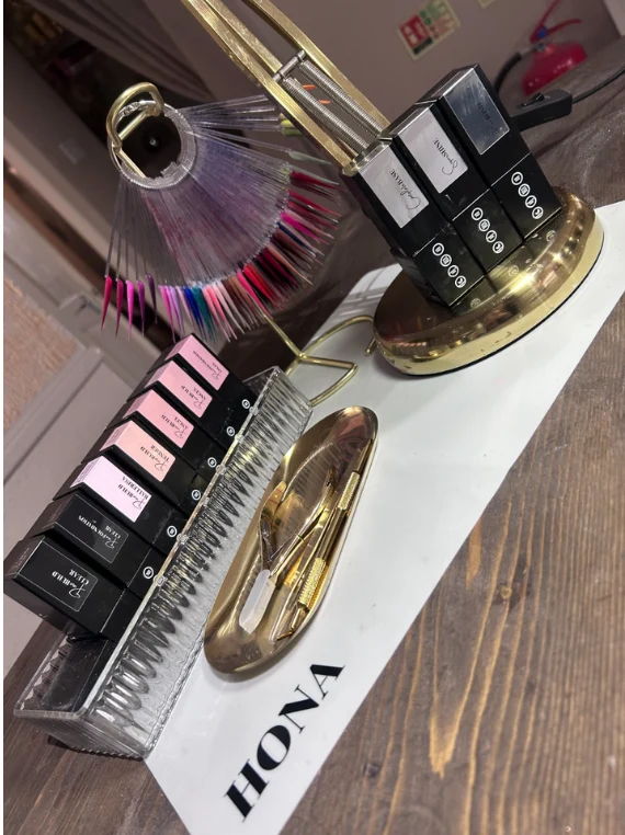 Nail polish bottles and accessories displayed on a stylish surface.
