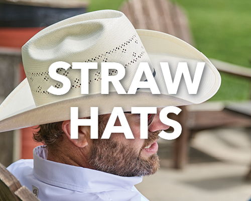 A person wearing a straw hat sitting in a chair.