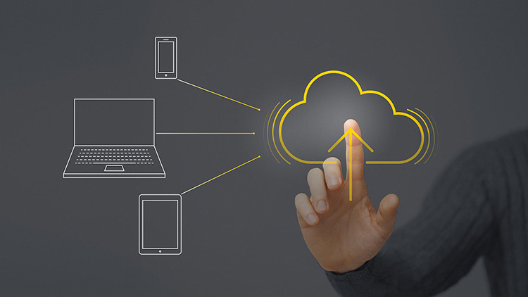 A hand touching a cloud icon connecting devices.
