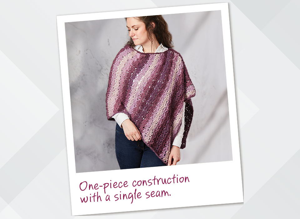 Woman wearing a poncho with one-piece construction and a single seam.