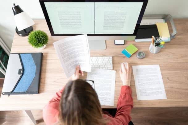 Editor in front of computer