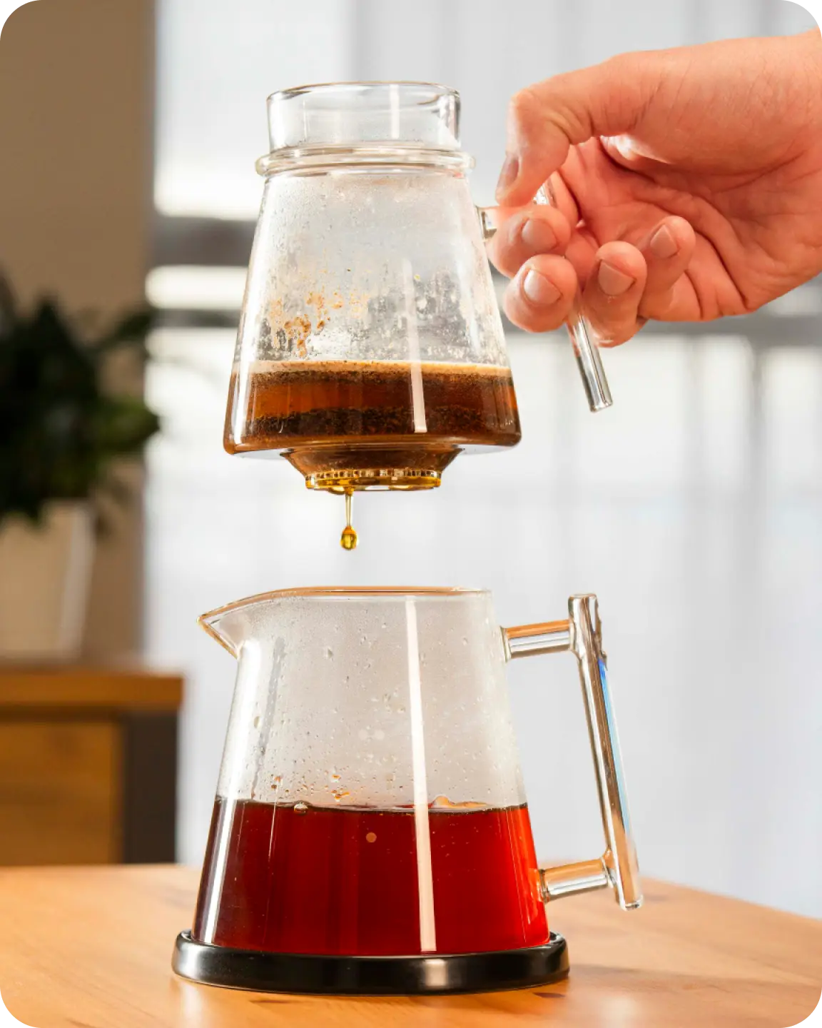 Lifting the Pure Over dripper as the coffee finishes