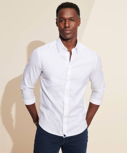 Model is wearing a  white UNTUCKit button-down. 