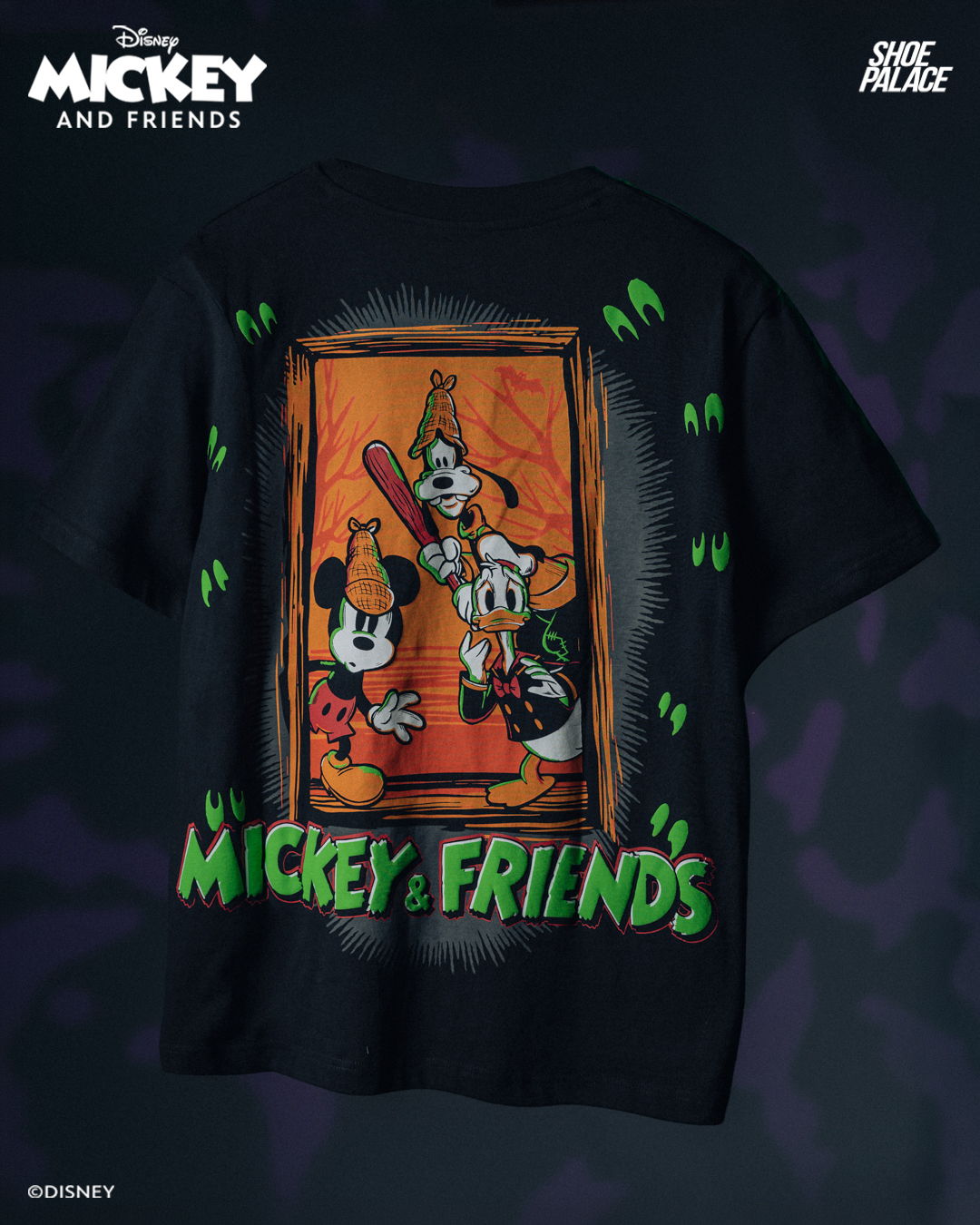 Black t-shirt featuring Mickey and friends graphic design.