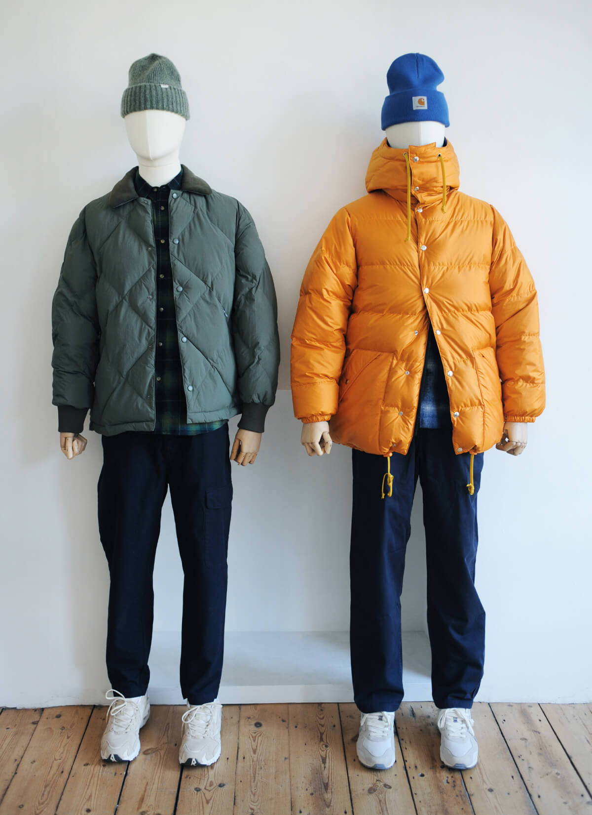Two mannequins styled with investment jackets for the festive season.