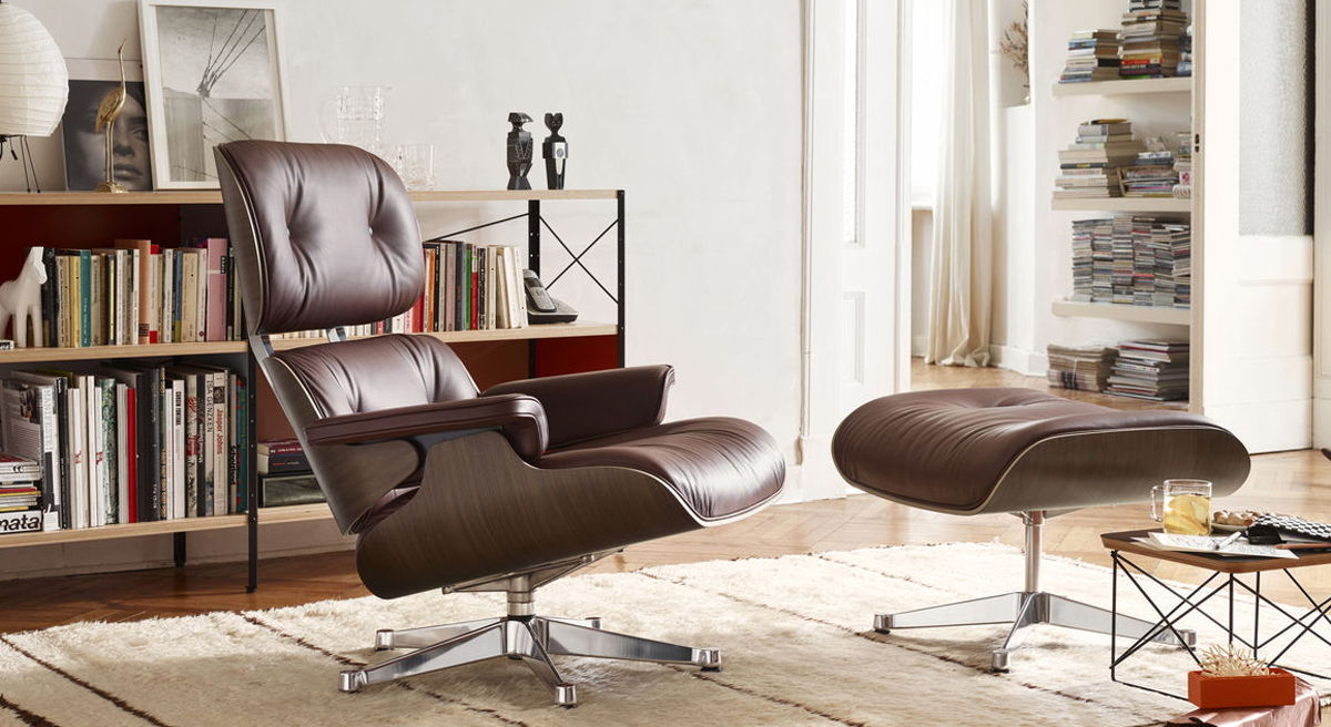 A brown leather chair and ottoman in a stylish living room setting.