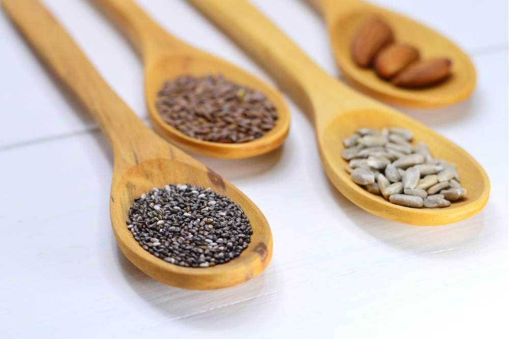 superfood good health wooden spoons nuts and seeds vitamins and minerals and the body