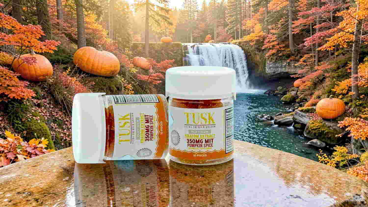 Two jars of cannabis products by a waterfall in autumn scenery.