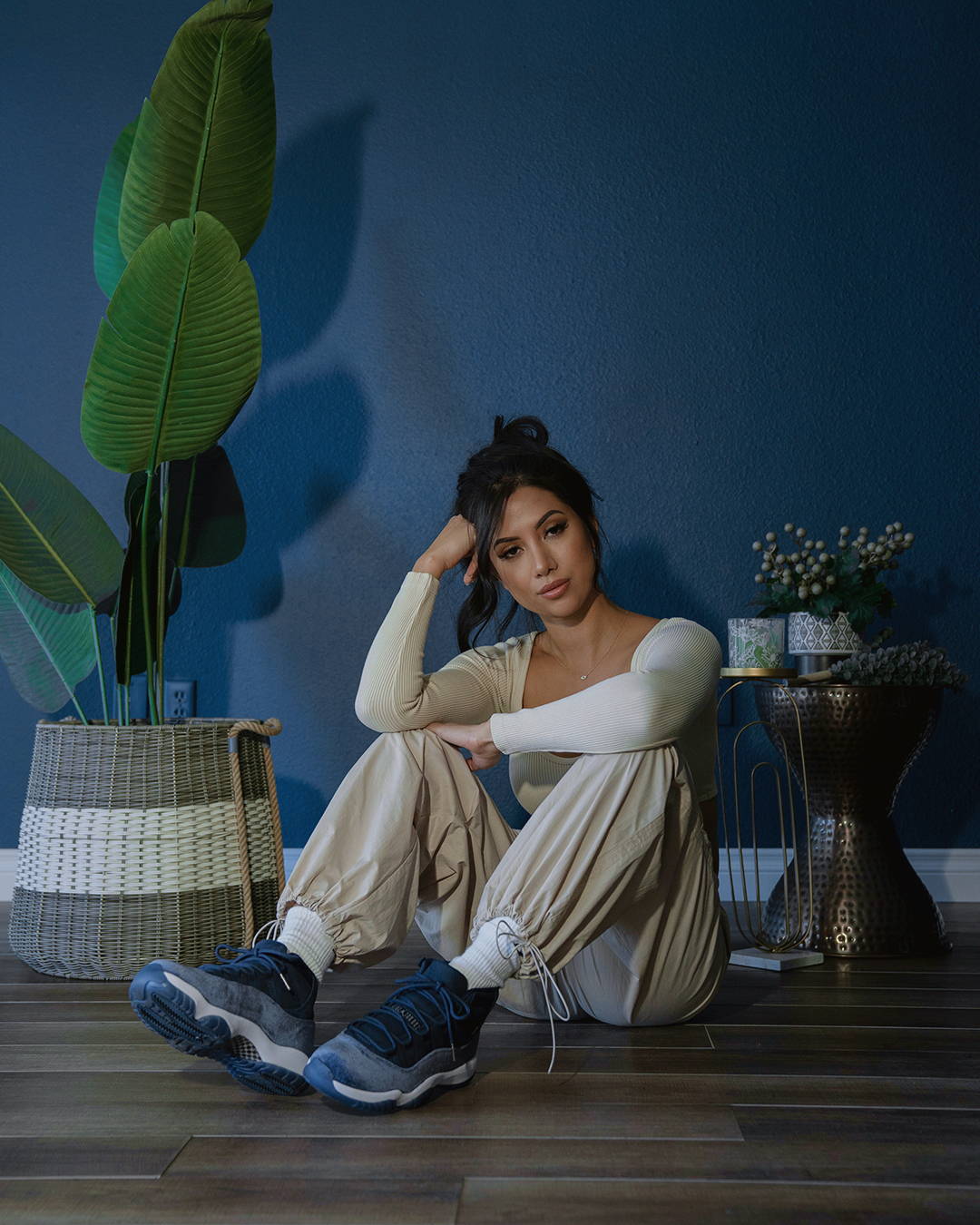 female model in aj11 retro midnight navy sitting on the floor