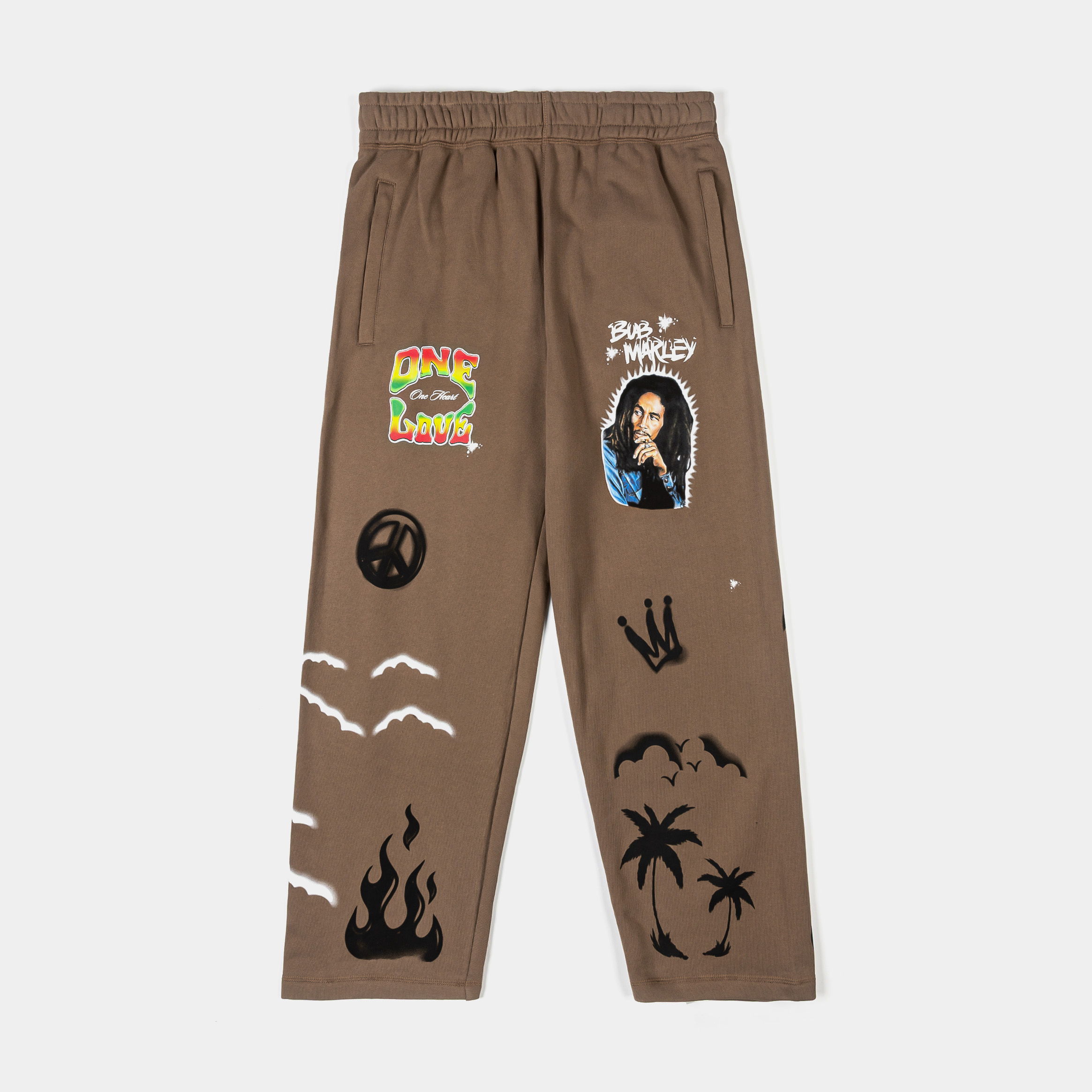Brown pants with various graphic designs and patches.
