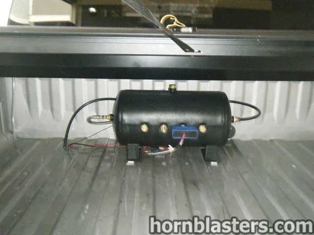 Air tank and compressor mounted in GMC Sierra truck bed