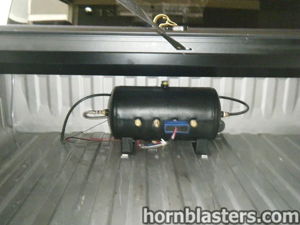 Air tank and compressor mounted in GMC Sierra truck bed