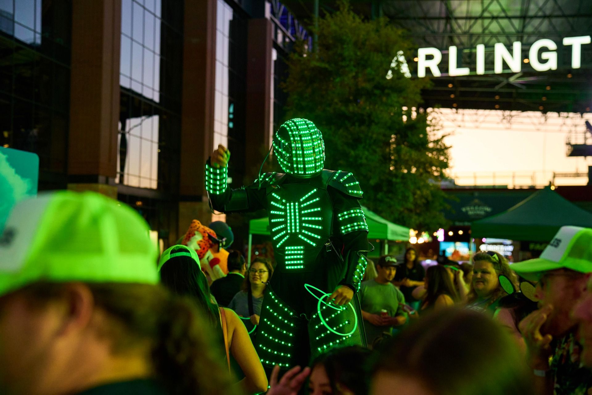 An LED robot performer entertains the crowd during the Pickle RAVE headlined by DJ PICKLE at The Big Dill pickle festival, Globe Life Field and Texas Live!, Arlington Texas 2025.