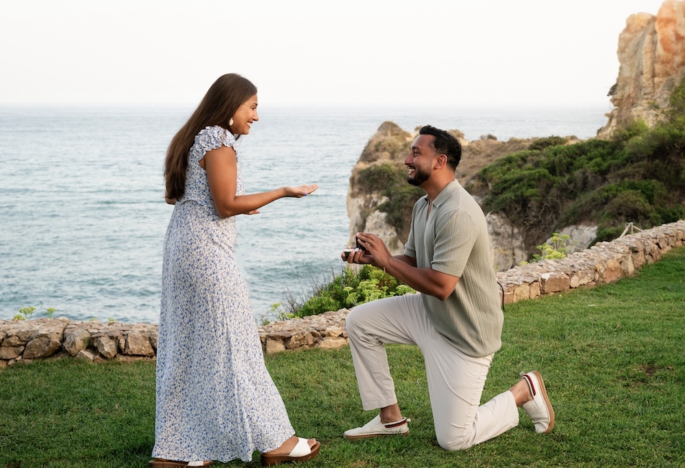 man on bended knee proposing, algarve, portugal