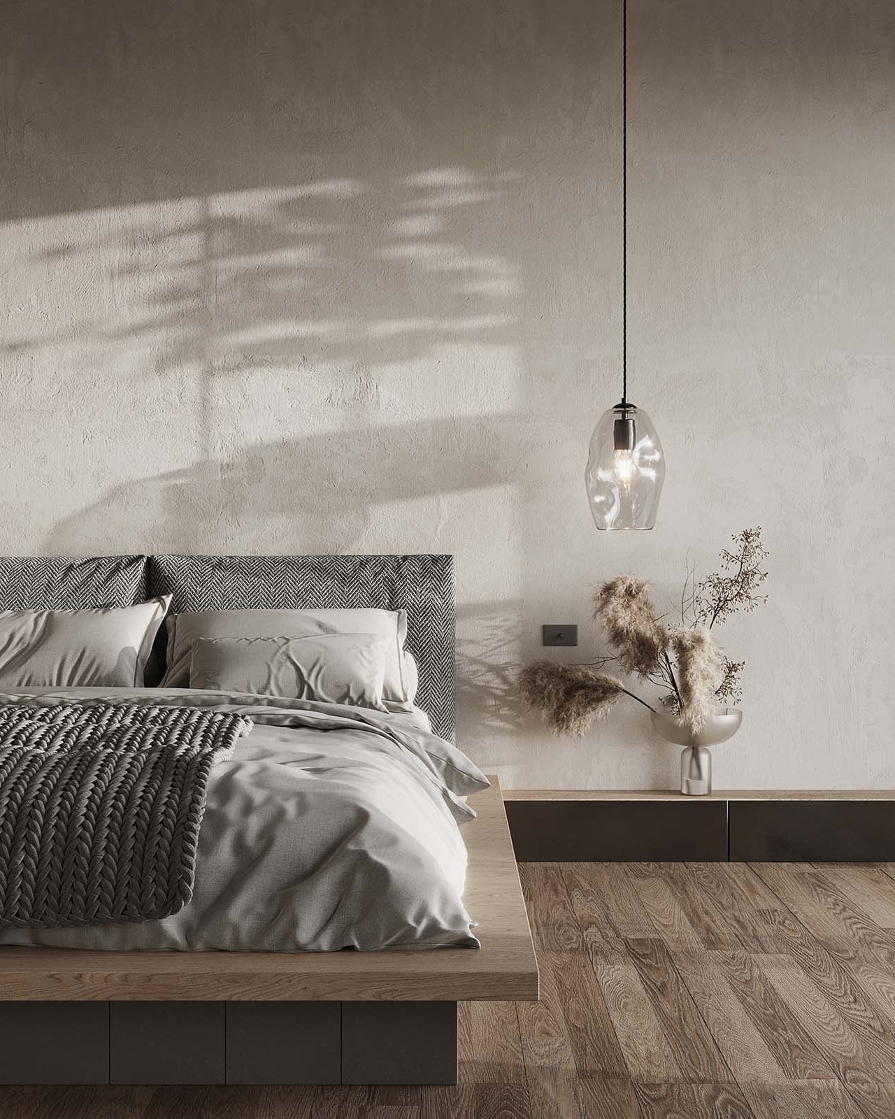 Modern bedroom with a bed, headboard, and pendant light.