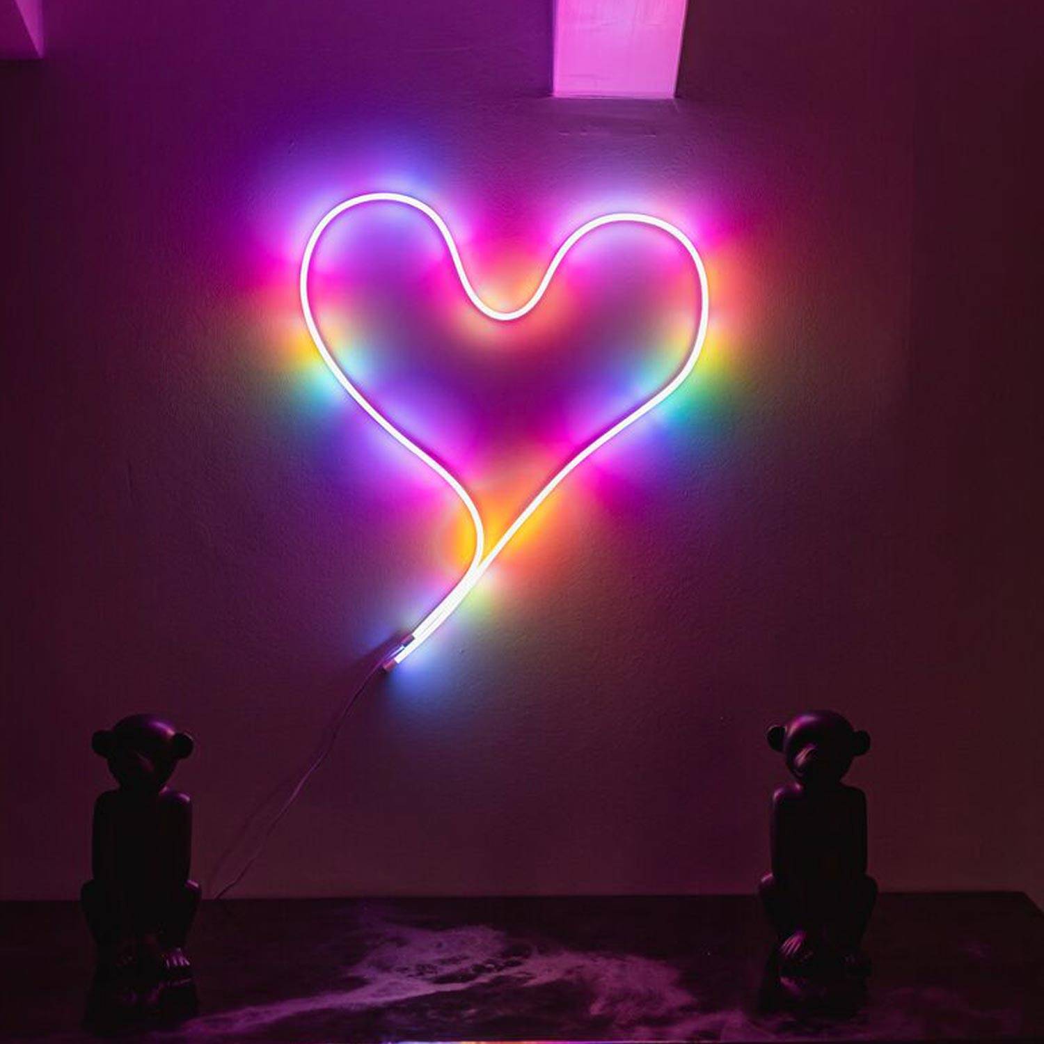 Twinkly Flex moulded into the shape of a heart on a wall.