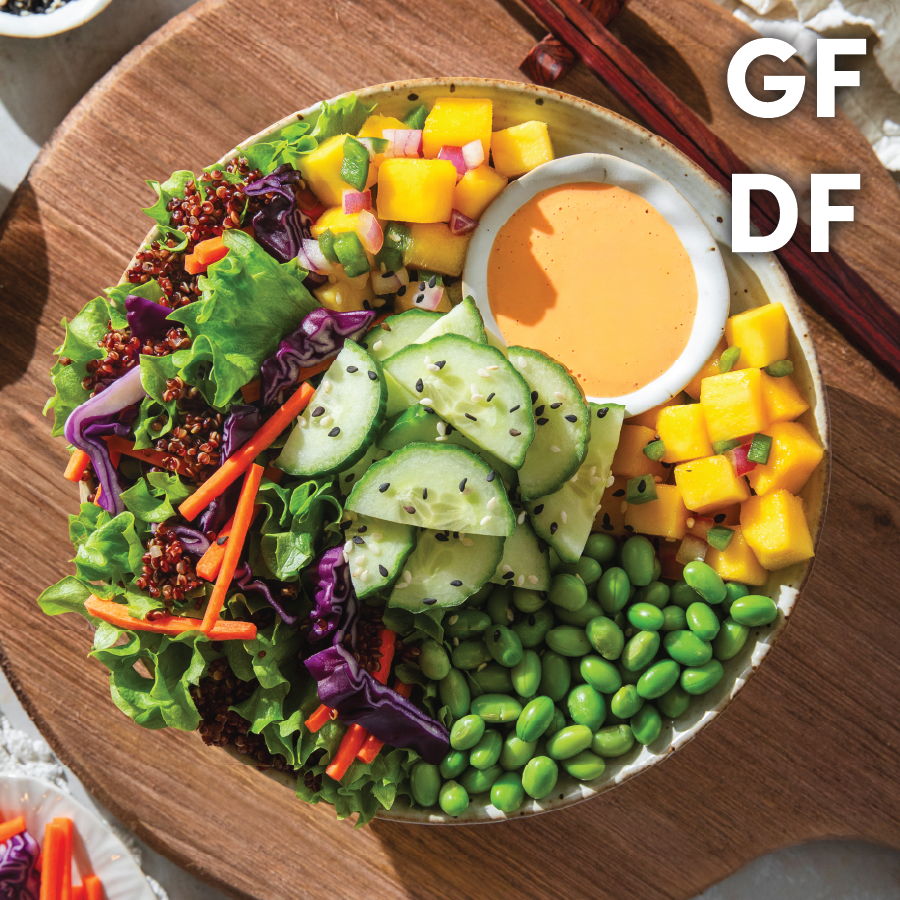 Colorful salad bowl with vegetables and dressing, labeled GF and DF.