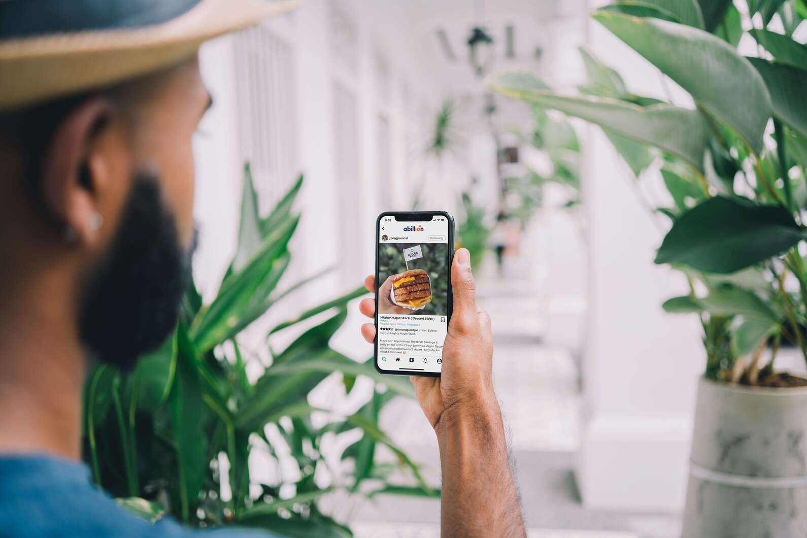 man using food logging app on smart phone