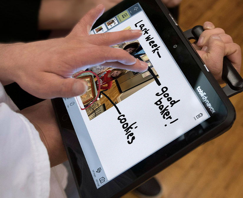 Man using TD Snap Aphasia on Tobii dynavox device