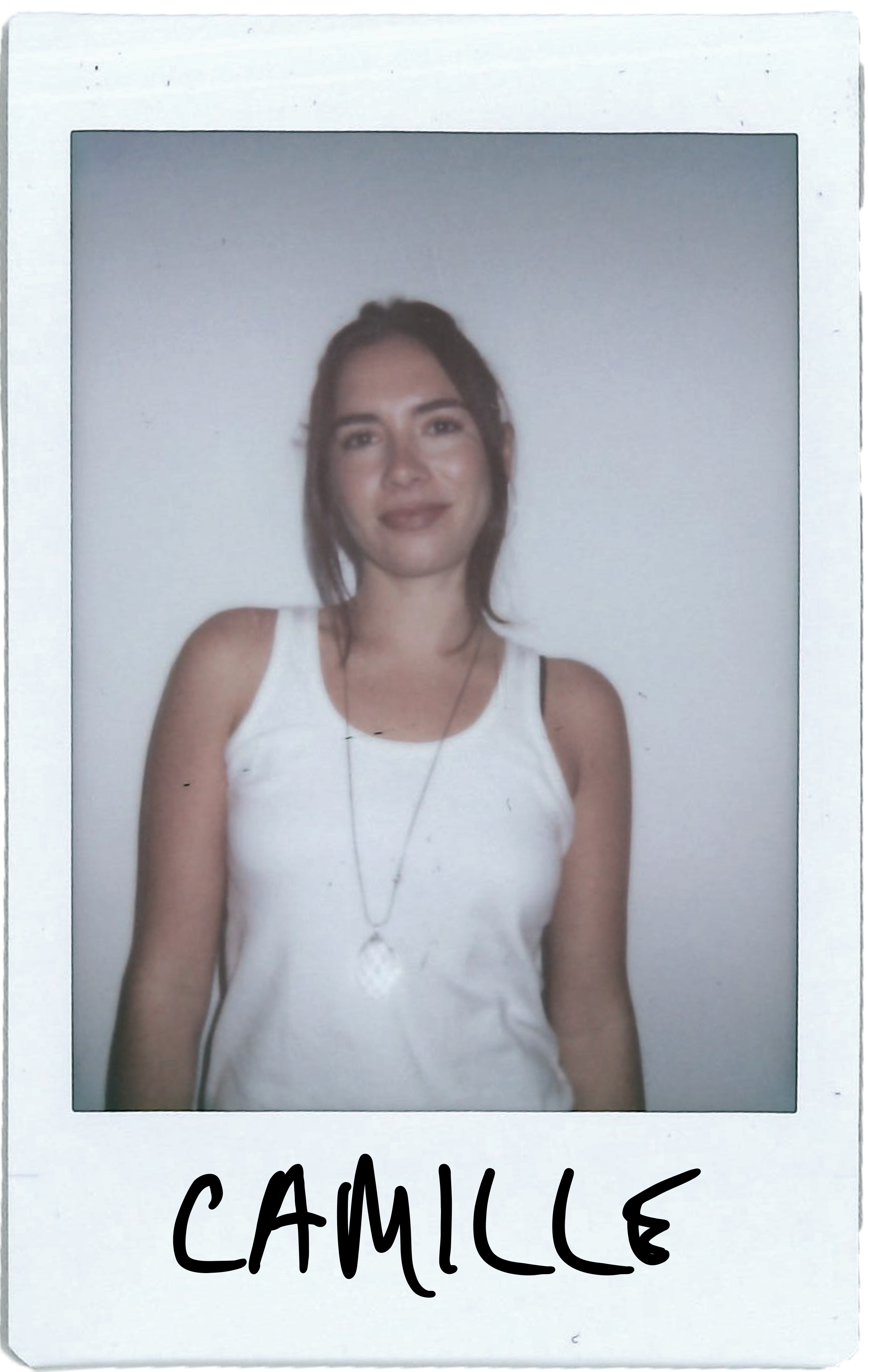 A woman in a tank top standing against a plain background, labeled 
