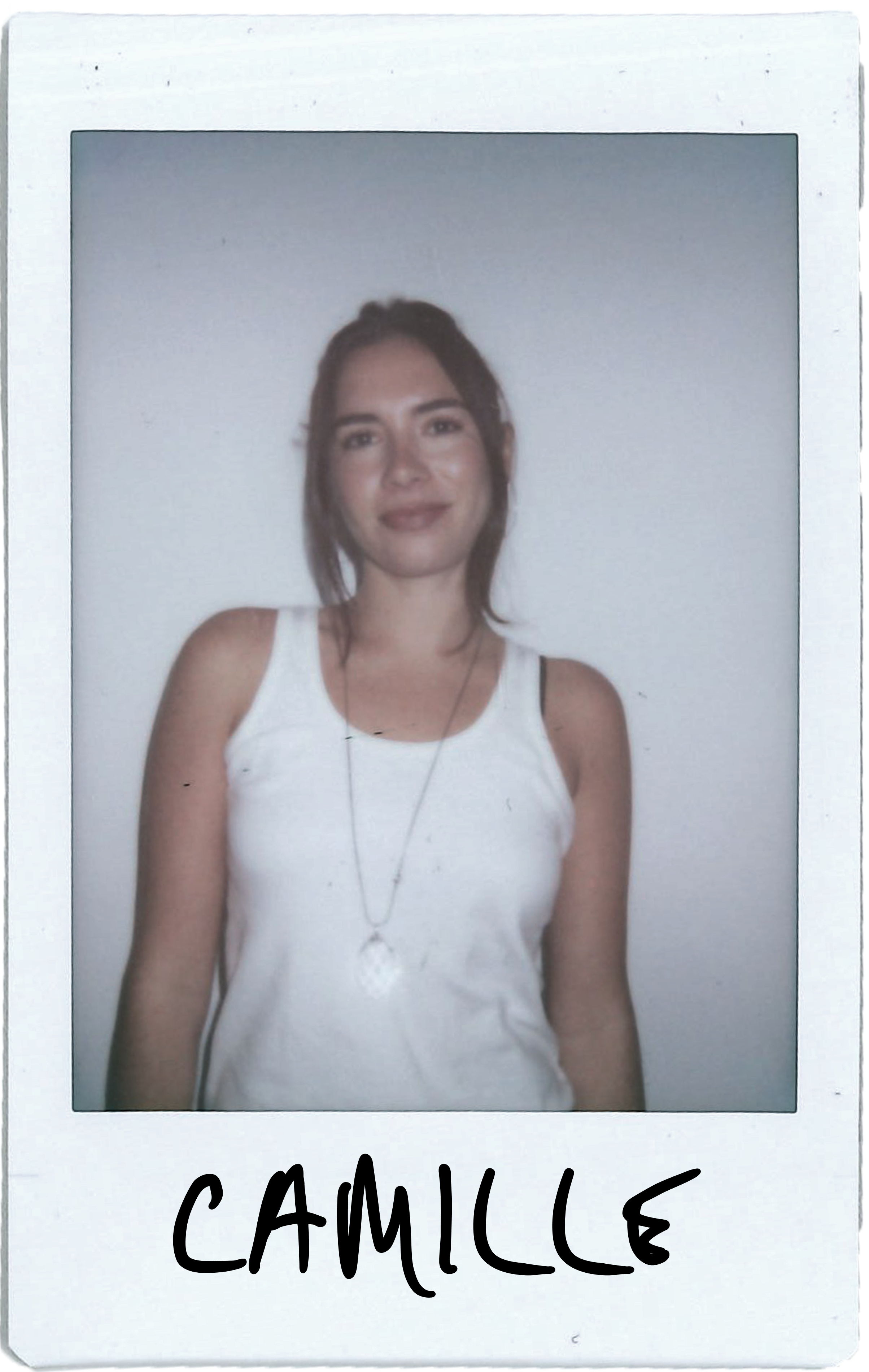 A woman in a tank top standing against a plain background, labeled 