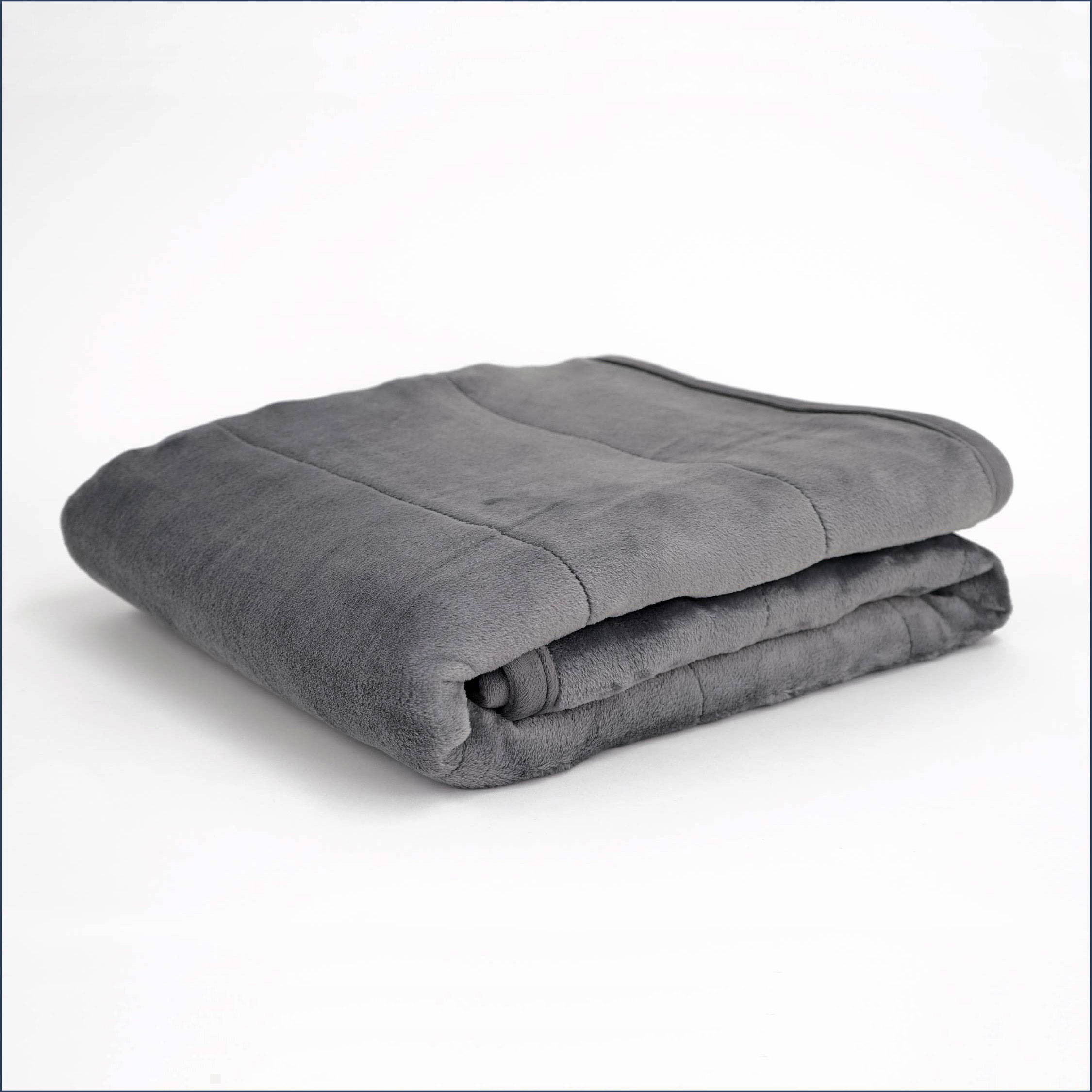 The Tuc Original Weighted Blanket folded on a white background