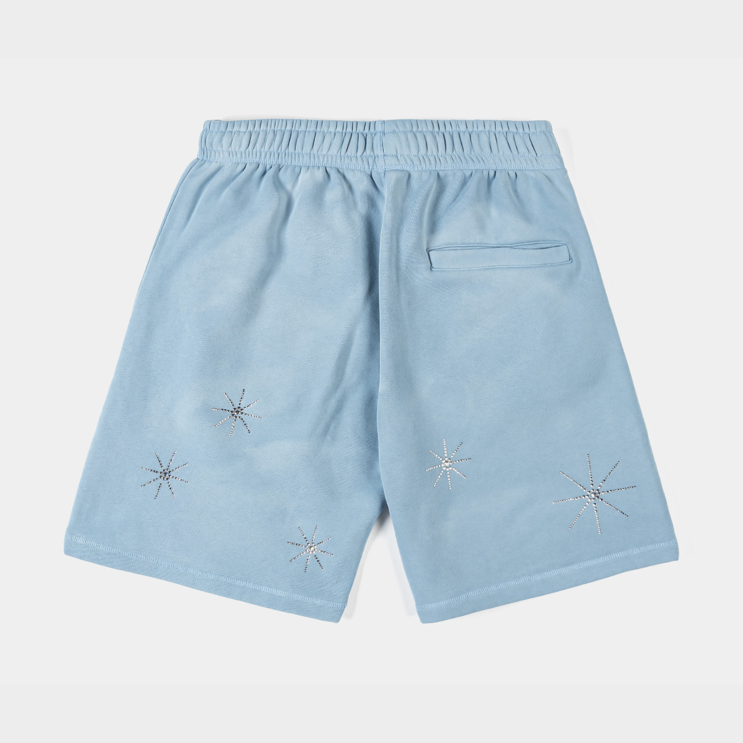 Light blue shorts with decorative religious graphics.