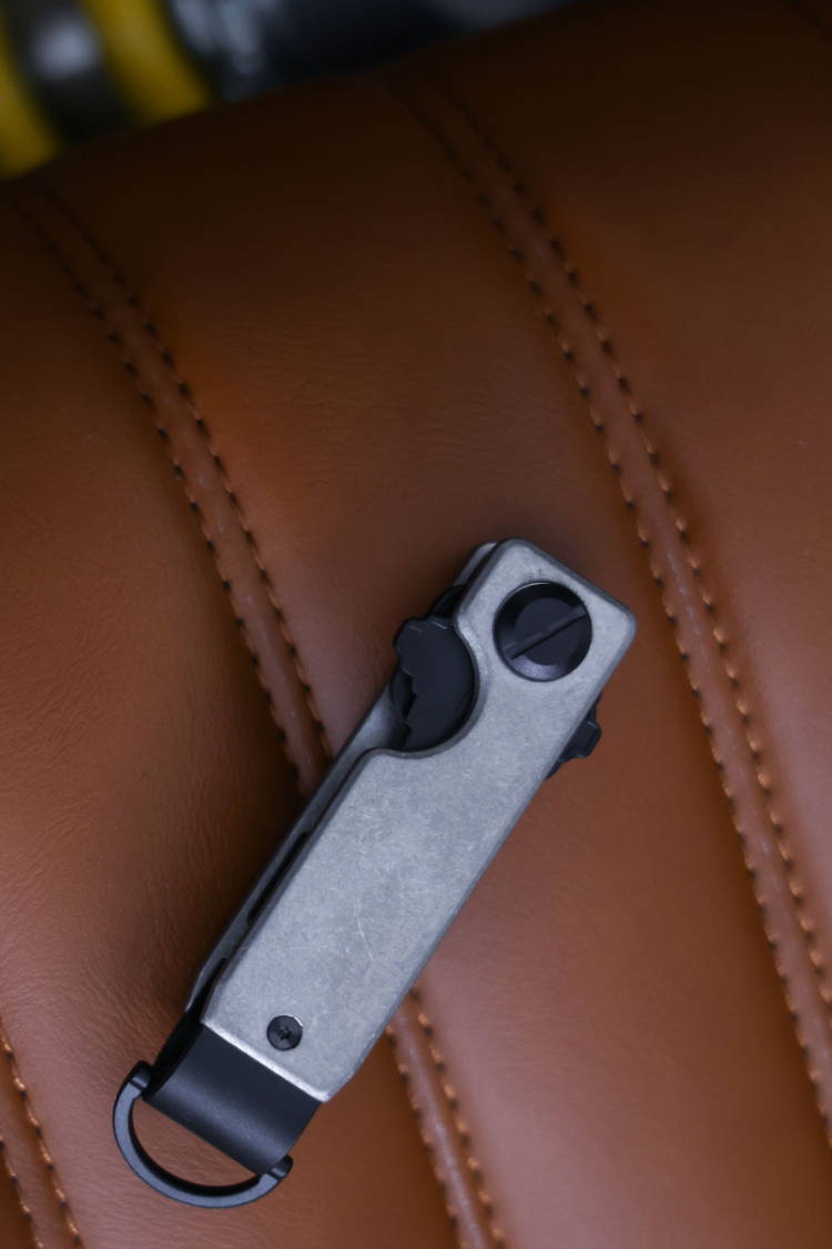 Stonewashed Titanium keycase with leather background