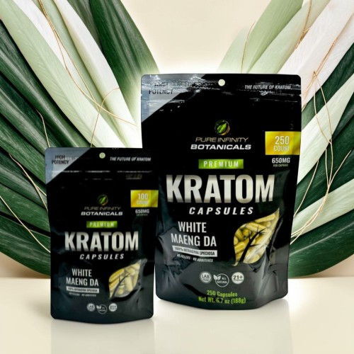Kratom capsules packaging with green leaves in the background.
