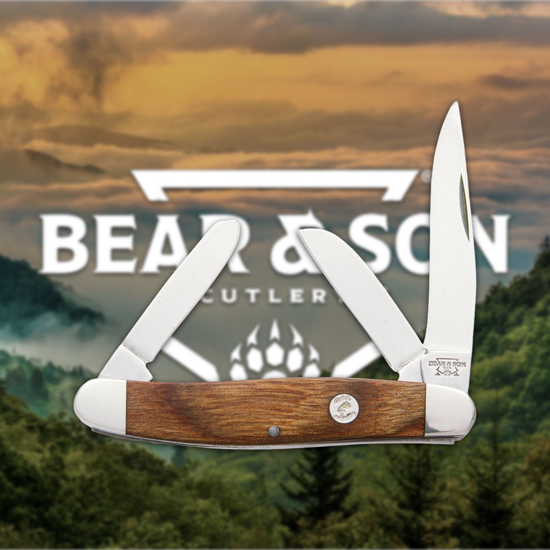 A folding knife with a wooden handle against a scenic background.