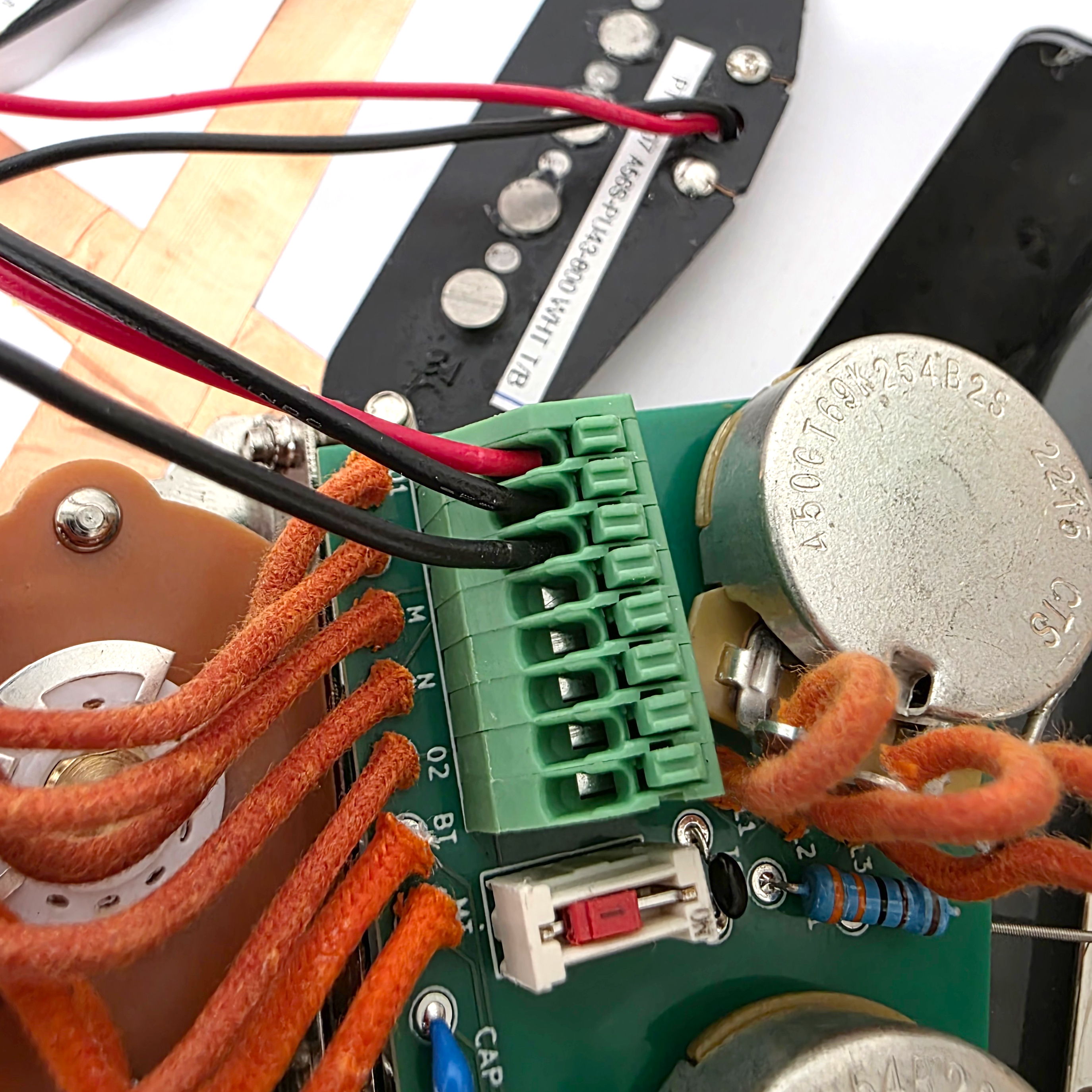Close-up of a circuit board with wires and components.