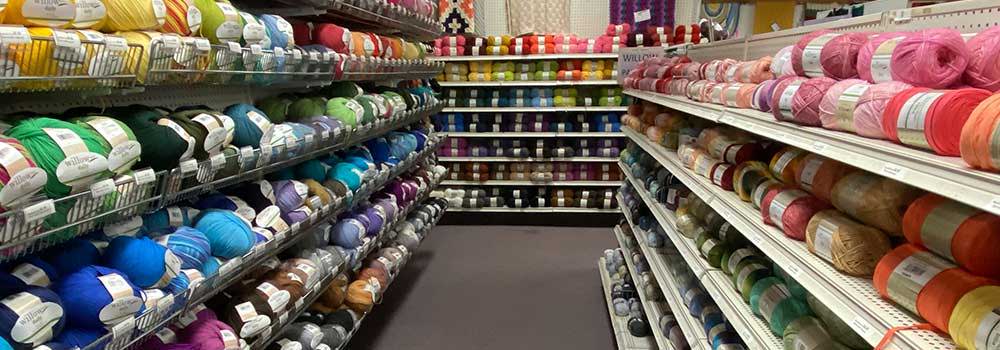 Herrschners Retail Store image of yarn stocked in shelves