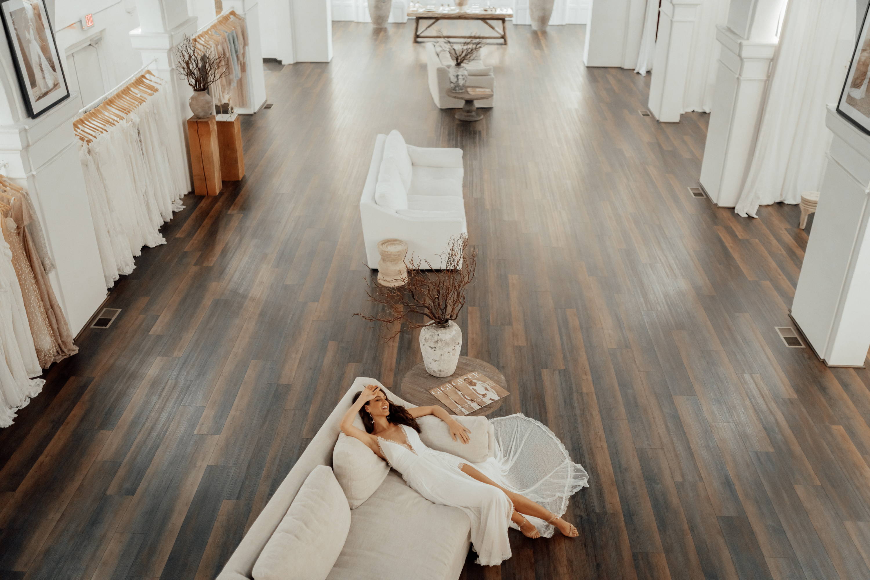 Open space bridal showroom with hardwood timber floors and whitewashed walls