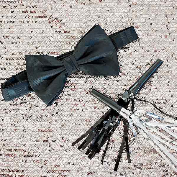 Dressy black bow tie with a noise maker