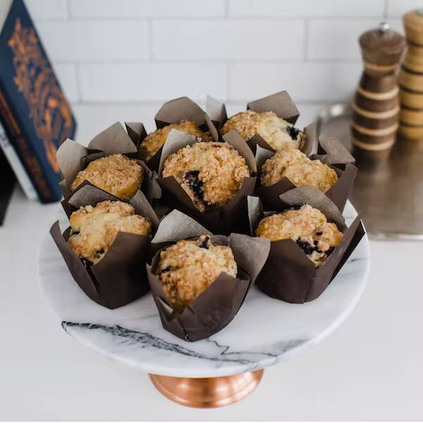 blueberry muffins on a marble stand