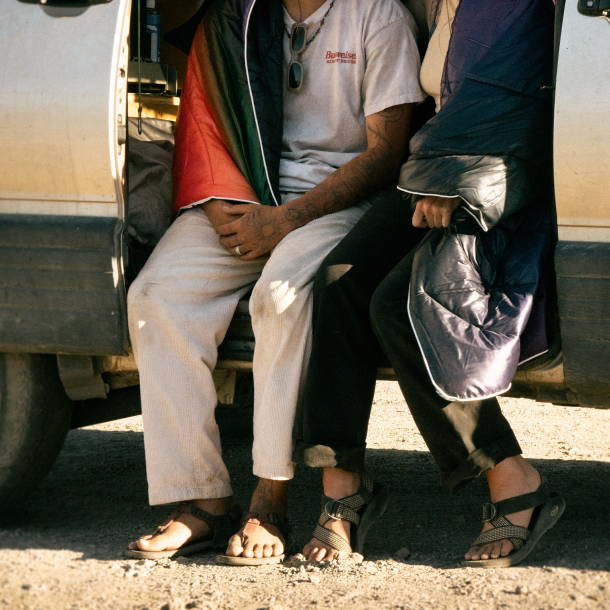 Two people sitting in a van together