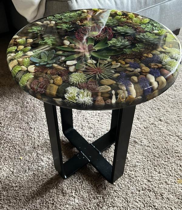 An epoxy table top with a underwater floral theme