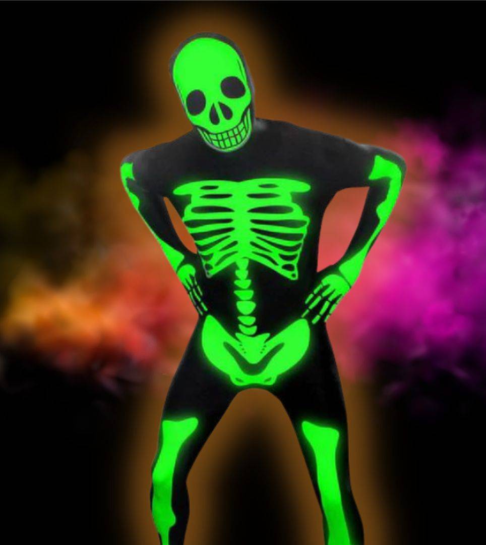 Person in black and green glow in the dark skeleton jumpsuit. Shop skeleton costumes and accessories.