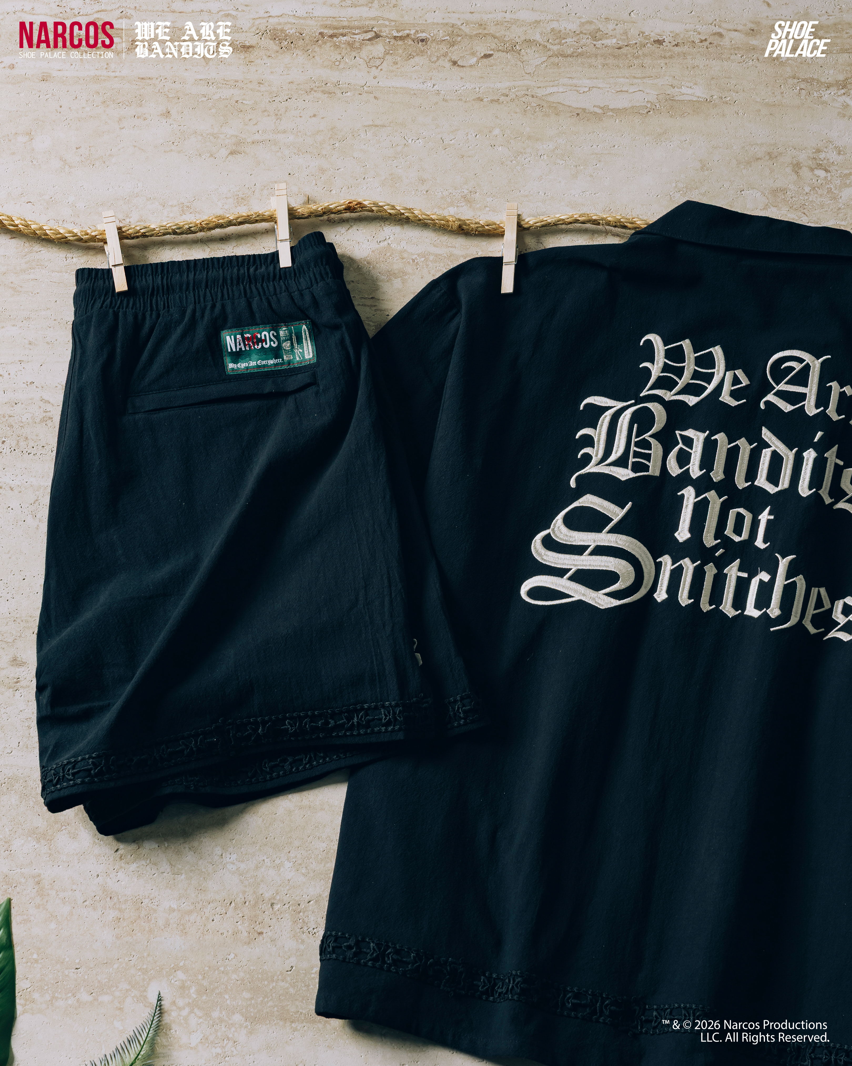 Black jacket and shorts hanging, with text 