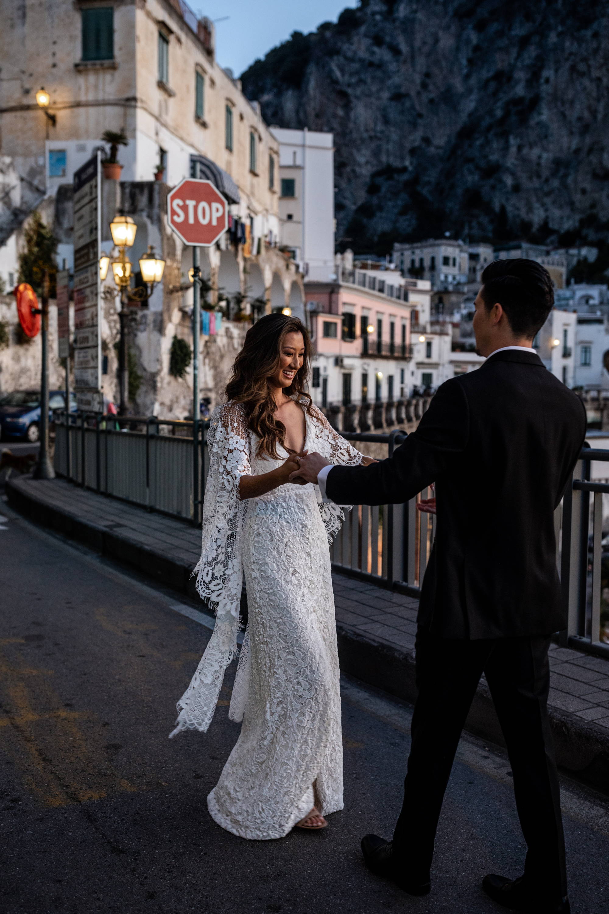 Grace Loves Lace bride wearing the Verdelle 2 gown with her groom on the road