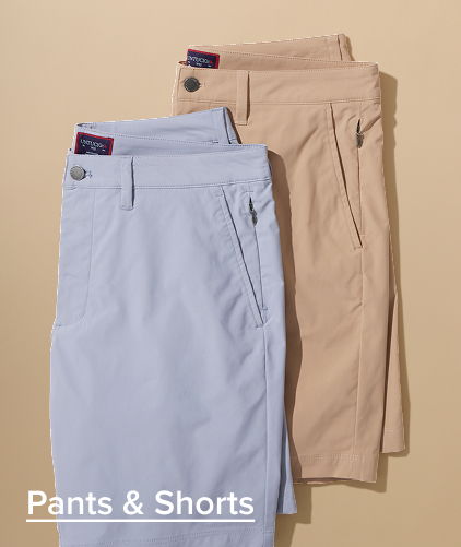 Three pairs of pants and shorts in various colors.