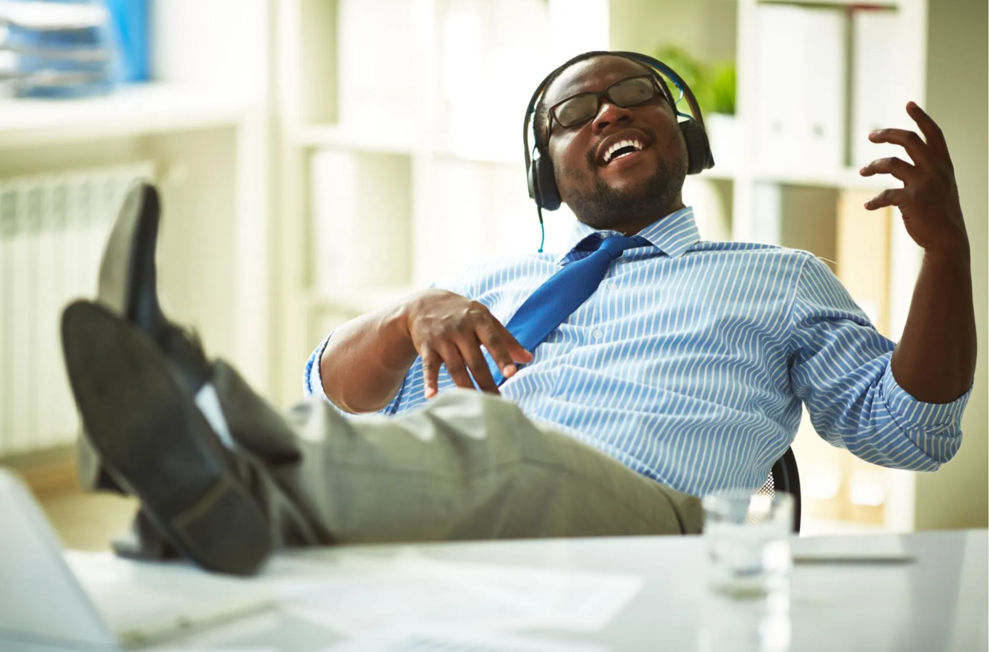 man with headphones jamming out to music 