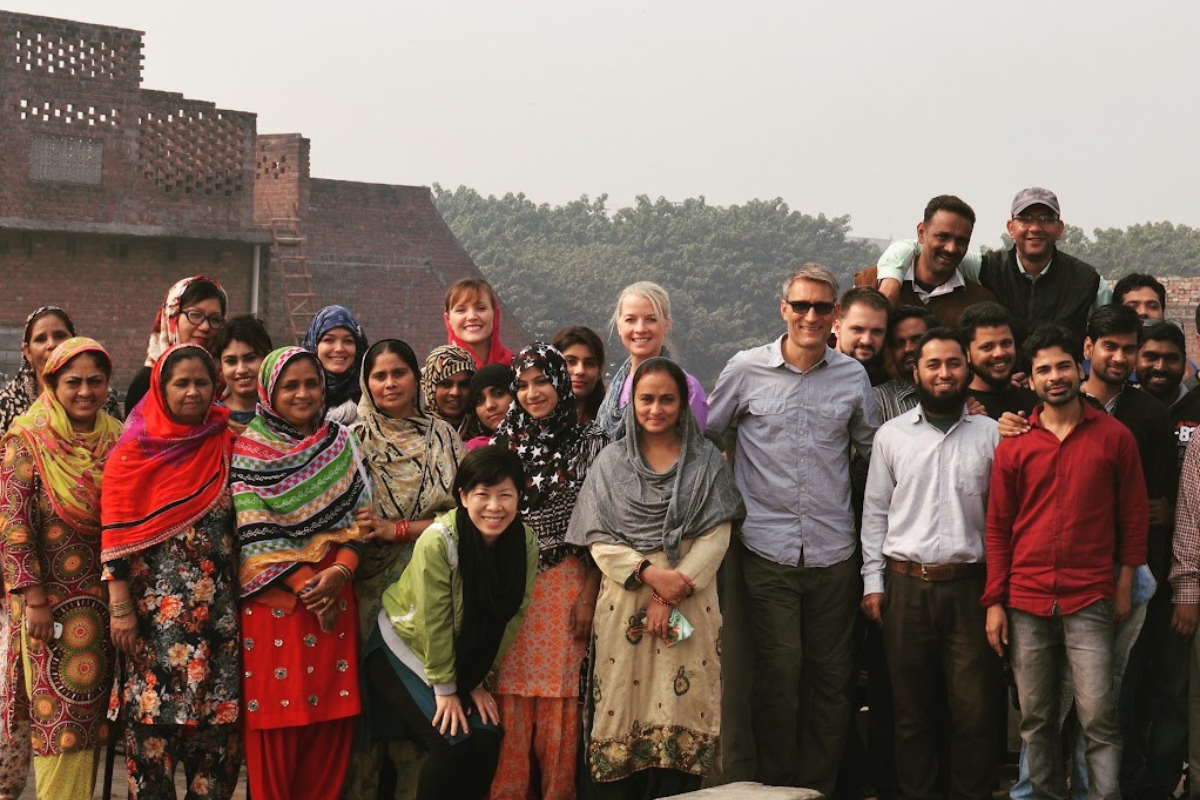 Group photo of the MADE FREE Team smiling outdoors.