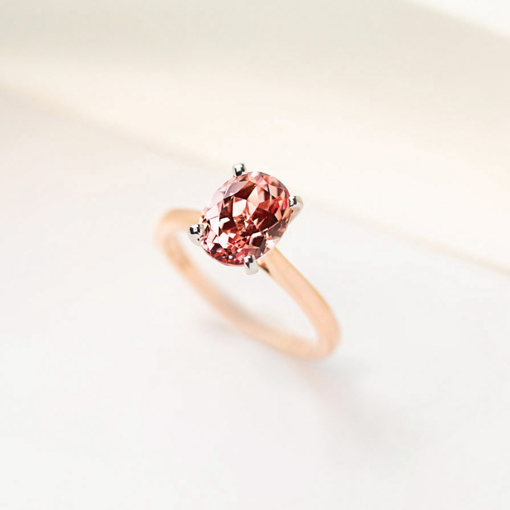 2ct oval cut lab grown champagne pink sapphire ring in 14k yellow gold
