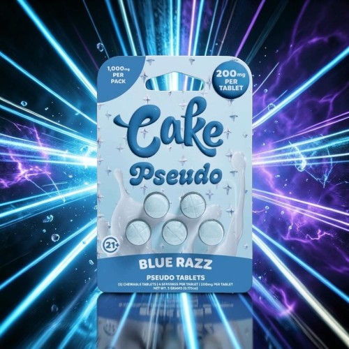 Packaging of Cake Pseudo Blue Razz edible tablets against a vibrant background.