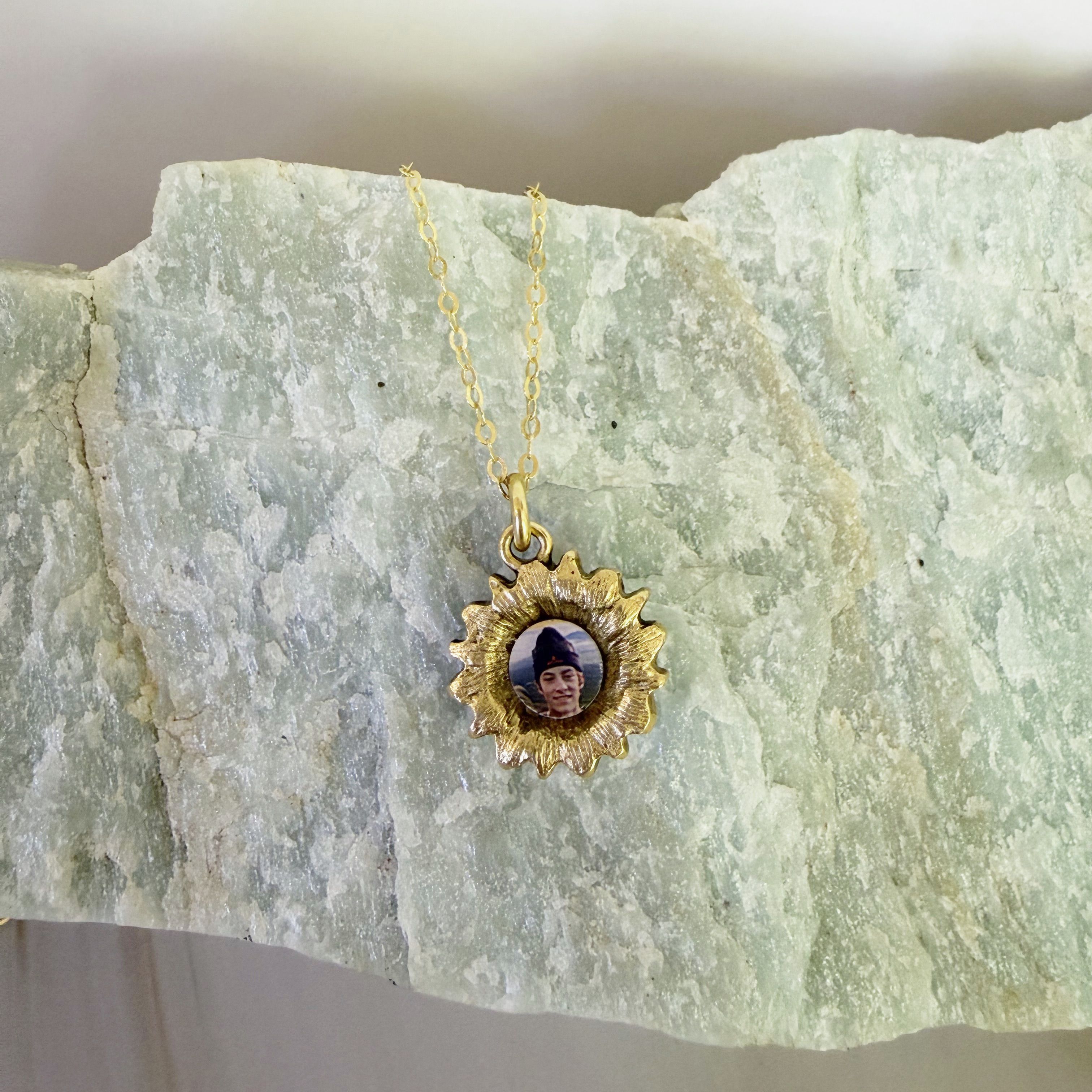 Back of The Mandy Locket showing a close-cropped photo sealed in resin