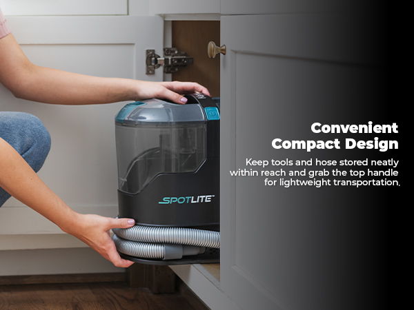 Person using a compact vacuum cleaner with a convenient top handle.