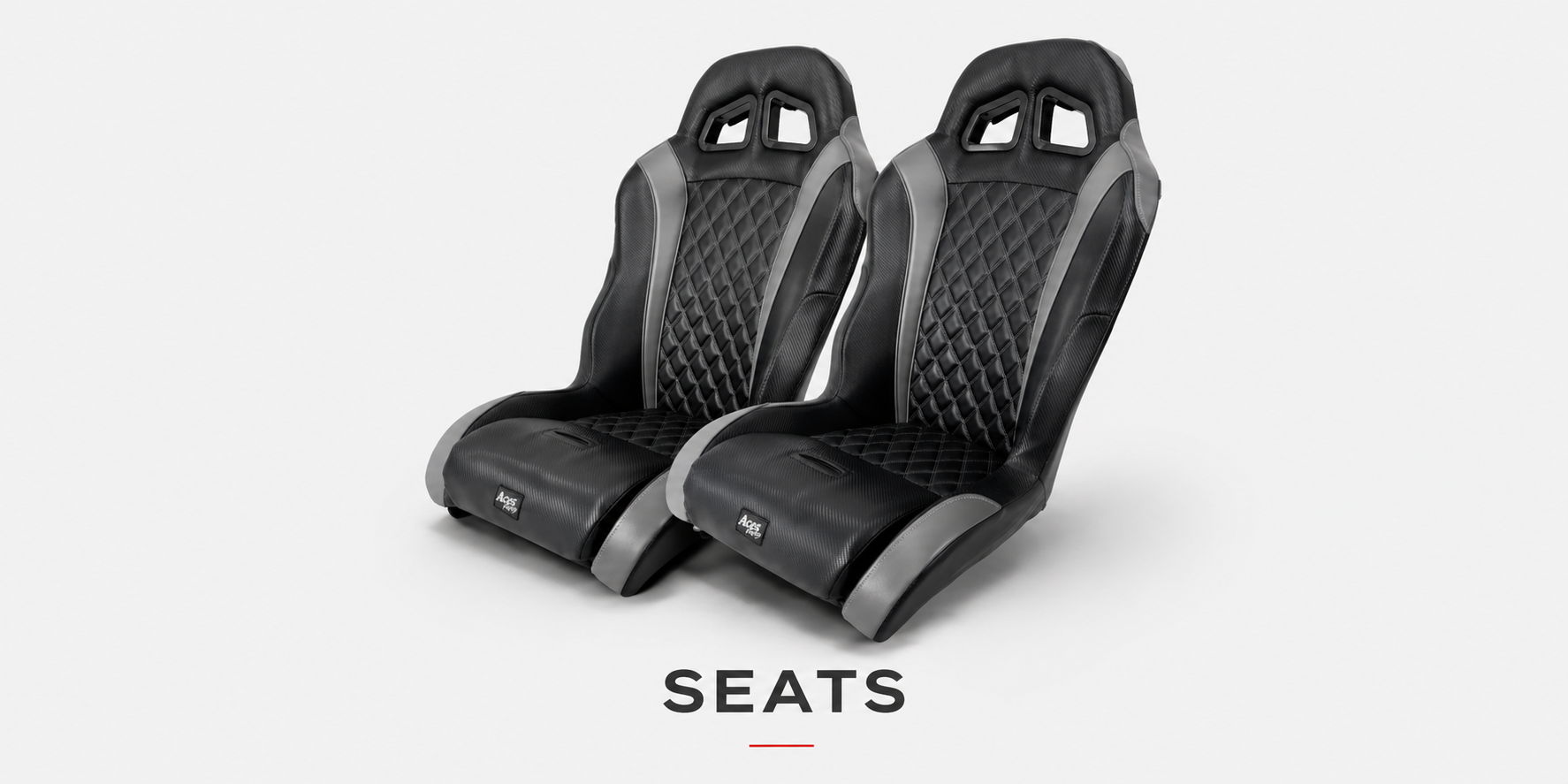 Two modern black car seats on a light background.